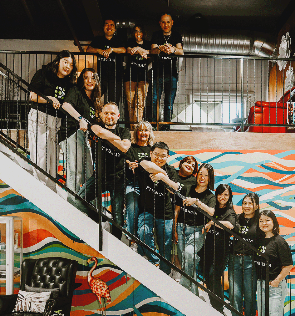 Kickbyte Digital team posing together on a staircase